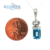 Sterling Silver Rhodium Plated Pendant with One 6mm x 9mm Oval Cut Blu